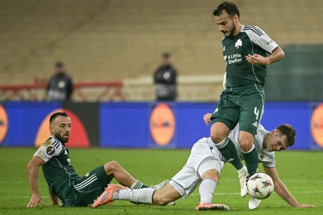Panathinaikos' Spanish midfielder #4 Pedro Chirivella (R) fights for the ball with Viktoria Plzen's Czech midfielder #09 Denis Visinsky (L) during the UEFA Europa League football match between Panathinaikos FC and Viktoria Plzen at the Apostolos Nikolaidis Stadium in Athens on December 11, 2025. (Photo by Aris MESSINIS / AFP)