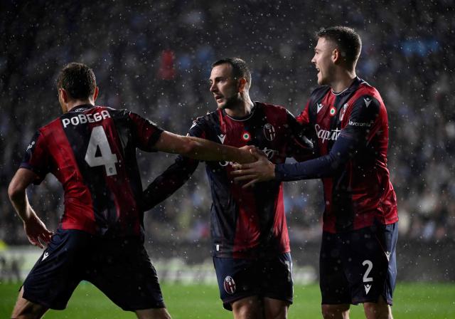 Bologna's Italian forward #10 Federico Bernardeschi (C) celebrates with teammates scoring his team's first goal from the penalty spot during the UEFA Europa League day 6 football match between RC Celta de Vigo and Bologna FC 1909 at the Balaidos stadium in Vigo on December 11, 2025. (Photo by Miguel RIOPA / AFP)