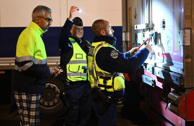French gendarmes inspect trucks during a control operation against drug trafficking at the A63 motorway tollbooth in Castets, south-western France on December 11, 2025. (Photo by Gaizka IROZ / AFP)