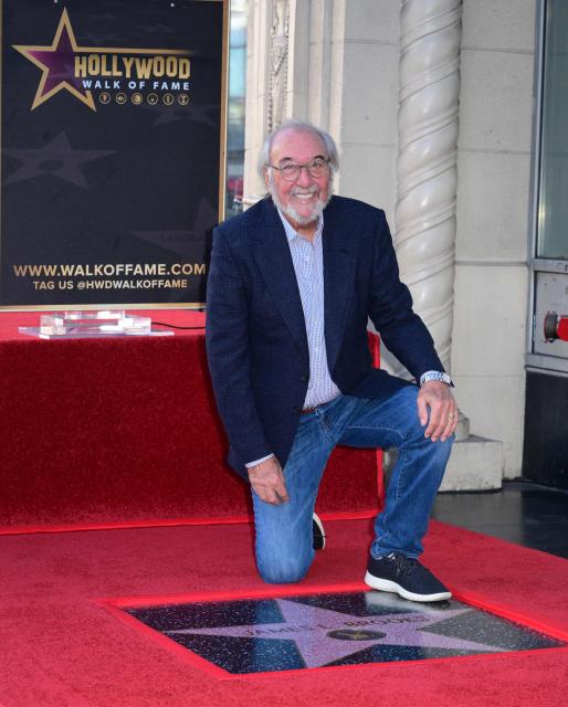 US director, writer and producer James L. Brooks poses during the unveiling ceremony of his star at the Hollywood Walk of Fame in Hollywood, California, on December 11, 2025. (Photo by Frederic J. BROWN / AFP)