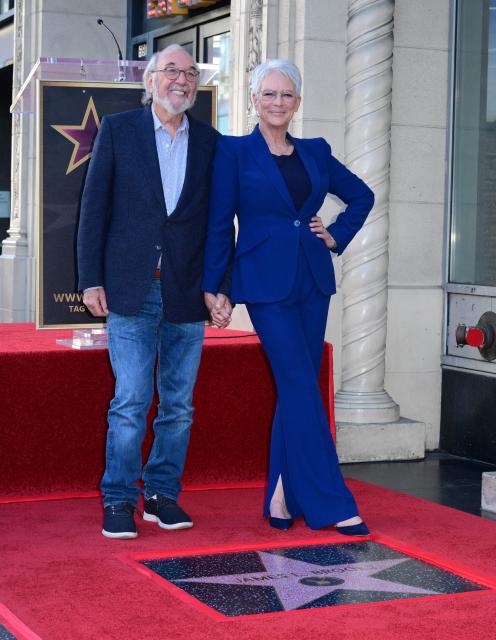 US director, writer and producer James L. Brooks (L) poses alongside US actress Jamie Lee Curtis during the unveiling ceremony of his star at the Hollywood Walk of Fame in Hollywood, California, on December 11, 2025. (Photo by Frederic J. BROWN / AFP)