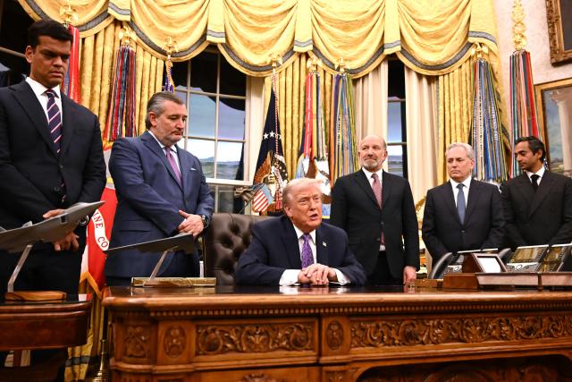 US President Donald Trump (3L) speaks, flanked by US Senator Ted Cruz (R-TX)(2L), US Secretary of Commerce Howard Lutnick (3R) and Chair of the President's Council of Advisors on Science and Technology David Sachs (R), during a signing ceremony on AI the Oval Office of the White House in Washington, DC, on December 11, 2025. (Photo by Alex WROBLEWSKI / AFP)