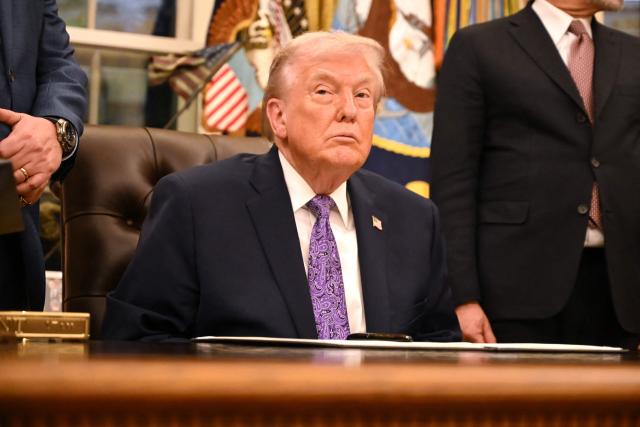 US President Donald Trump looks on during a signing ceremony on AI the Oval Office of the White House in Washington, DC, on December 11, 2025. (Photo by Alex WROBLEWSKI / AFP)