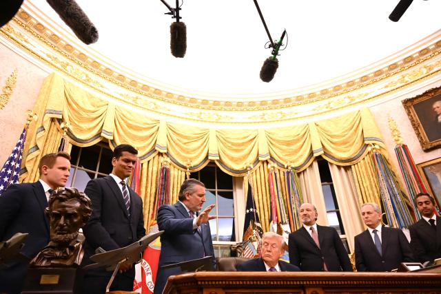 US President Donald Trump (C) listens as US Senator Ted Cruz (R-TX)(3L) speaks flanked by US Secretary of Commerce Howard Lutnick (3R) and Chair of the President's Council of Advisors on Science and Technology David Sachs (2R) during a signing ceremony on AI the Oval Office of the White House in Washington, DC, on December 11, 2025. (Photo by Alex WROBLEWSKI / AFP)