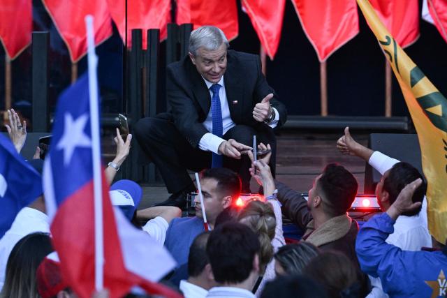 Chile's presidential candidate Jose Antonio Kast of the Republican Party gives a thumbs-up to supporters during his closing campaign rally in Temuco, Chile on December 11, 2025. The second round of the Chilean presidential election on December 14 will pit two candidates against each other who are diametrically opposed: Jeannette Jara, the representative of a broad left-wing coalition with modest origins, and the far-right leader Jose Antonio Kast, an ultraconservative Catholic determined to massively expel undocumented migrants. (Photo by Eitan ABRAMOVICH / AFP)