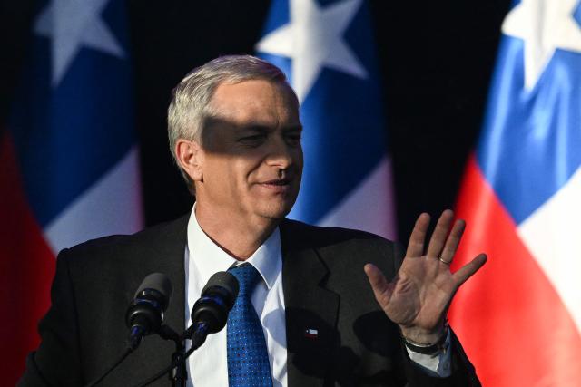 Chile's presidential candidate Jose Antonio Kast of the Republican Party waves to supporters during his closing campaign rally in Temuco, Chile on December 11, 2025. The second round of the Chilean presidential election on December 14 will pit two candidates against each other who are diametrically opposed: Jeannette Jara, the representative of a broad left-wing coalition with modest origins, and the far-right leader Jose Antonio Kast, an ultraconservative Catholic determined to massively expel undocumented migrants. (Photo by EITAN ABRAMOVICH / AFP)