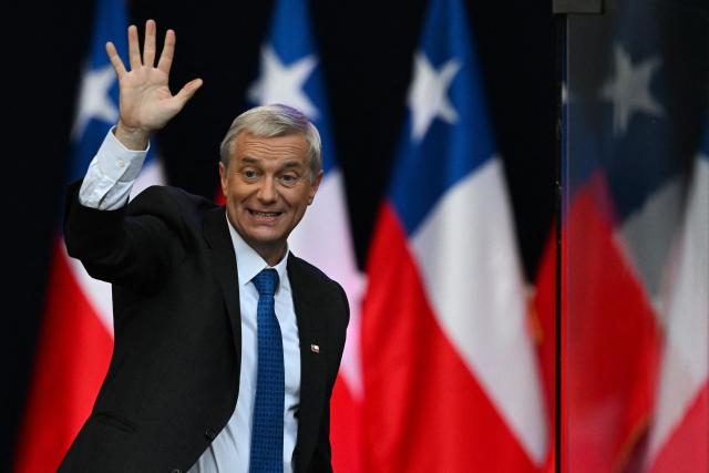 Chile's presidential candidate Jose Antonio Kast of the Republican Party waves to supporters during his closing campaign rally in Temuco, Chile on December 11, 2025. The second round of the Chilean presidential election on December 14 will pit two candidates against each other who are diametrically opposed: Jeannette Jara, the representative of a broad left-wing coalition with modest origins, and the far-right leader Jose Antonio Kast, an ultraconservative Catholic determined to massively expel undocumented migrants. (Photo by EITAN ABRAMOVICH / AFP)