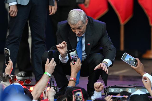Chile's presidential candidate Jose Antonio Kast of the Republican Party talks to supporters during his closing campaign rally in Temuco, Chile on December 11, 2025. The second round of the Chilean presidential election on December 14 will pit two candidates against each other who are diametrically opposed: Jeannette Jara, the representative of a broad left-wing coalition with modest origins, and the far-right leader Jose Antonio Kast, an ultraconservative Catholic determined to massively expel undocumented migrants. (Photo by EITAN ABRAMOVICH / AFP)