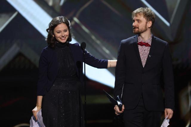 French singer Alice Duport-Percier (L) and Lorien Testard, composer of the soundtrack of the video game Clair Obscur: Expedition 33, accept the award for Best Score and Music during The Game Awards at the Peacock Theater in Los Angeles, California, on December 11, 2025. (Photo by Michael Tran / AFP)