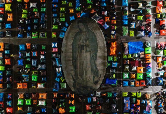 Aerial view as faithfuls camp outside the Basilica of Our Lady of Guadalupe in Mexico City on December 11, 2025. (Photo by Alfredo ESTRELLA / AFP)