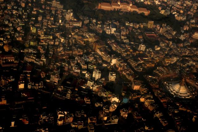 An aerial view of Kathmandu valley is pictured from an aircraft, in Kathmandu on December 12, 2025. (Photo by PRAKASH MATHEMA / AFP)