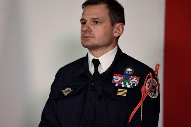 New commander of the National Gendarmerie Intervention Group (GIGN) Colonel Benoit Villeminoz listens to the speech of France's Minister of the Interior during a ceremony to officially take command in Versailles, west of Paris on December 12, 2025. (Photo by STEPHANE DE SAKUTIN / AFP)