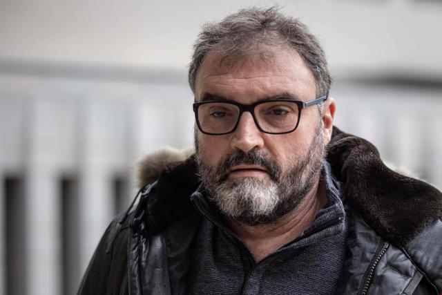 (FILES) Frederic Pechier, an anaesthetist now suspected of poisoning patients in 32 cases (with 13 lethal outcomes) at the Besancon hospital arrives at the Besancon courthouse on March 8, 2023. Described by the prosecution as "one of the most notorious criminals in French legal history", he faces life imprisonment but maintains his innocence: French anaesthetist Frederic Pechier, who has been on trial for three months in Besançon for 30 cases of poisoning, including 12 fatalities, will learn his sentence on December 12, 2025. (Photo by ARNAUD FINISTRE / AFP)