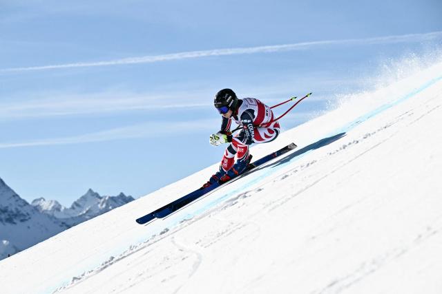 France's Romane Miradoli competes in the women's downhill race part of the FIS Alpine Ski World Cup 2025-2026, in St Moritz, south-eastern Switzerland on December 12, 2025. (Photo by Fabrice COFFRINI / AFP)