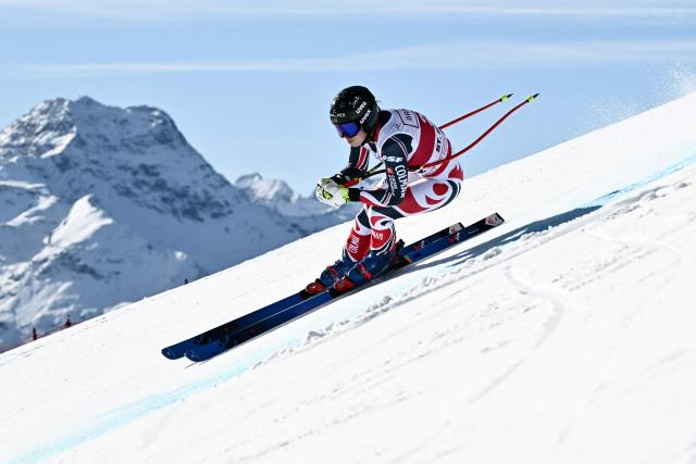 France's Romane Miradoli competes in the women's downhill race part of the FIS Alpine Ski World Cup 2025-2026, in St Moritz, south-eastern Switzerland on December 12, 2025. (Photo by Fabrice COFFRINI / AFP)