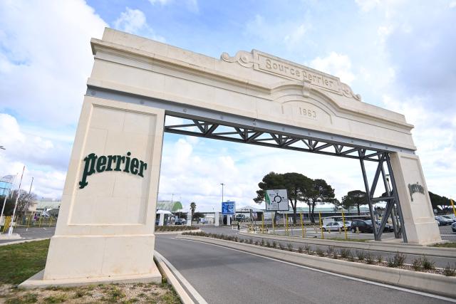 (FILES) This photograph shows the entrance of the Perrier factory in Vergeze, southern France, on February 7, 2025. The Perrier production site in Vergeze, in the Gard department of France, has been shut down by order of the prefecture due to an incident at its internal water treatment plant, according to information obtained from the prefecture on December 12, 2025, confirming a report by Radio France. (Photo by Sylvain THOMAS / AFP)