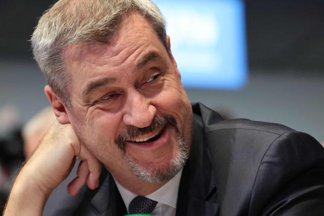 Bavaria's State Premier and leader of the conservative Christian Social Union (CSU) Markus Soeder is seen as he arrives to a congress of the Christian Social Union (CSU) party on December 12, 2025 in Munich, southern Germany. (Photo by Alexandra BEIER / AFP)