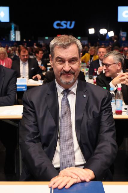 Bavaria's State Premier and leader of the conservative Christian Social Union (CSU) Markus Soeder sits prior to a congress of the Christian Social Union (CSU) party on December 12, 2025 in Munich, southern Germany. (Photo by Alexandra BEIER / AFP)