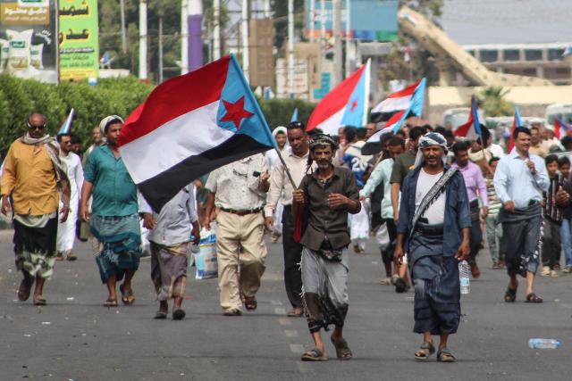 Supporters of the Southern Transitional Council (STC), a coalition of separatist groups seeking to restore the state of South Yemen, wave South Yemen flags during a demonstration calling for the revival of the former independent state, in Aden on December 12, 2025. The UAE-backed Southern Transitional Council last week swept through swathes of Yemen in a near-bloodless takeover they say aimed to expel Islamists and halt smuggling for the benefit of the Iran-backed Houthis. (Photo by Saleh Al-OBEIDI / AFP)