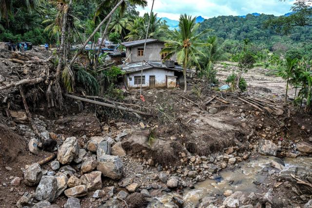 A general view shows a landslide-affected area in the aftermath of Cyclone Ditwah, in Badulla on December 12, 2025. Two tropical storms dumped massive amounts of rain on the countries last month, prompting landslides and flooding that killed more than 600 people in Sri Lanka and nearly 1,000 in Indonesia. (Photo by Ishara S. KODIKARA / AFP)