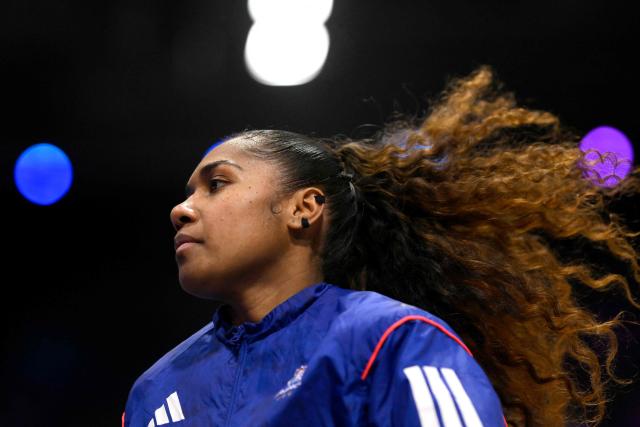 France's wing #98 Suzanne Wajoka warms up ahead of the IHF Women's Handball World Championship semi final match between France and Germany in Rotterdam Ahoy Arena, in Rotterdam, on December 12, 2025. (Photo by JOHN THYS / AFP)