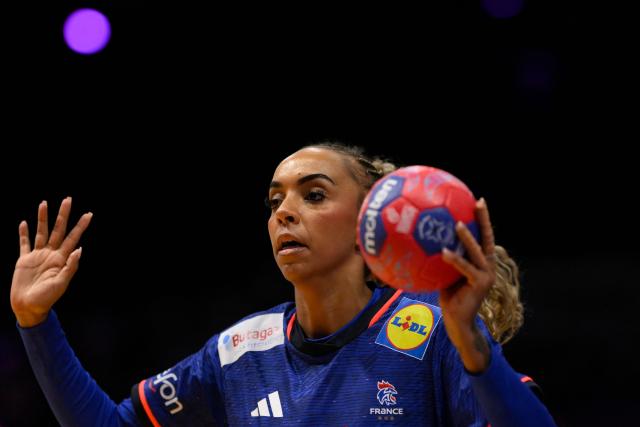 France's right back #15 Marie-Helene Sajka warms up ahead of the IHF Women's Handball World Championship semi final match between France and Germany in Rotterdam Ahoy Arena, in Rotterdam, on December 12, 2025. (Photo by JOHN THYS / AFP)