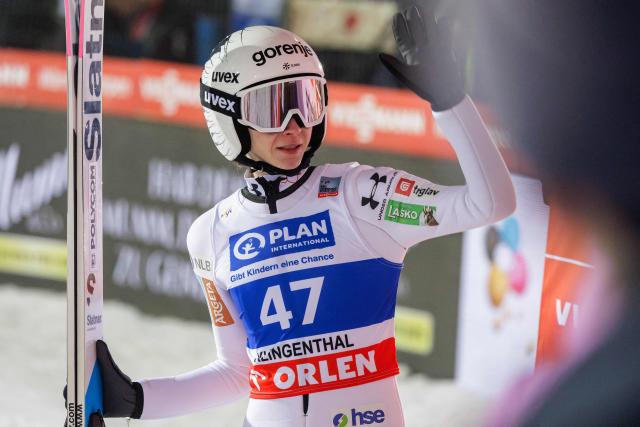 Slovenia's Nika Prevc reacts after competing in the women's Individual Large Hill HS140 event of the FIS Ski Jumping World Cup in Klingenthal, eastern Germany on December 12, 2025. Japan's Nozomi Maruyama won the event ahead of Slovenia's Nika Prevc (2nd) and Austria's Lisa Eder (3rd). (Photo by JENS SCHLUETER / AFP)