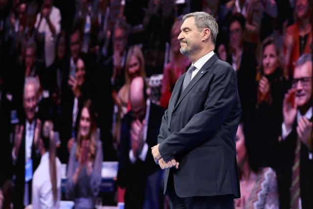 Bavaria's State Premier and leader of the conservative Christian Social Union (CSU) Markus Soeder gestures after delivering his speech during a congress of the Christian Social Union (CSU) party on December 12, 2025 in Munich, southern Germany. (Photo by Alexandra BEIER / AFP)
