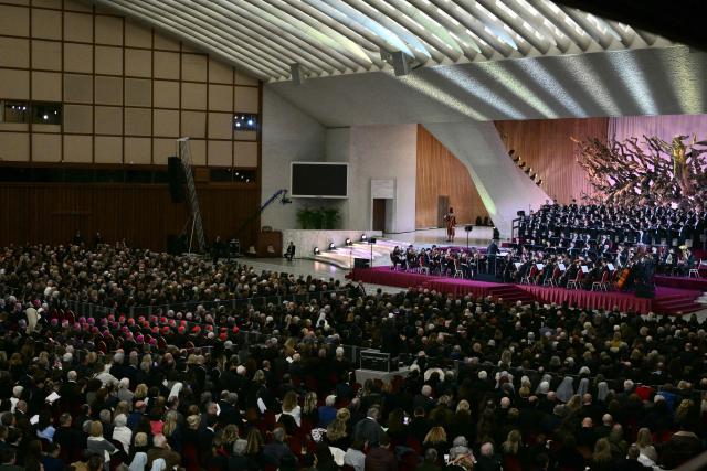 Pope Leo XIV (L) attends a Christmas concert directed by conductor Riccardo Muti, also winner of the Ratzinger Prize 2025, at Paul-VI audience hall in The Vatican on December 12, 2025. (Photo by Tiziana FABI / AFP)