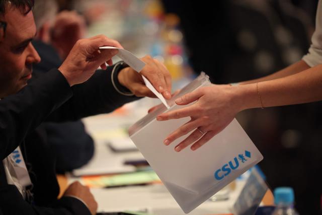 Delegates vote during a congress of the Christian Social Union (CSU) party on December 12, 2025 in Munich, southern Germany. (Photo by Alexandra BEIER / AFP)