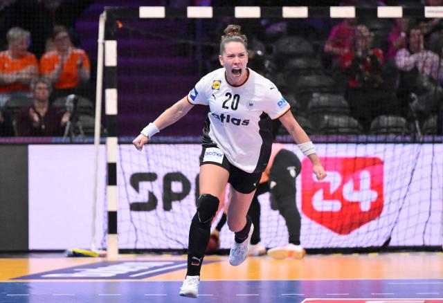 Germany's left back #20 Emily Vogel (C) celebrates after scoring during the IHF Women's Handball World Championship semi final match between France and Germany in Rotterdam Ahoy Arena, in Rotterdam, on December 12, 2025. (Photo by JOHN THYS / AFP)