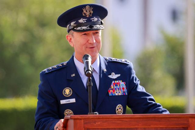 US Air Force Gen. Dan Caine, chairman of the Joint Chiefs of Staff, speaks during the relinquishment of command and retirement ceremony for US Navy Adm. Alvin Holsey at US Southern Command (SOUTHCOM) headquarters in Doral, Florida, on December 12, 2025. The US admiral responsible for overseeing a major military buildup in the Caribbean and controversial strikes on alleged drug-smuggling boats stepped down on Friday just a year into his tenure. (Photo by Eva Marie UZCATEGUI / AFP)