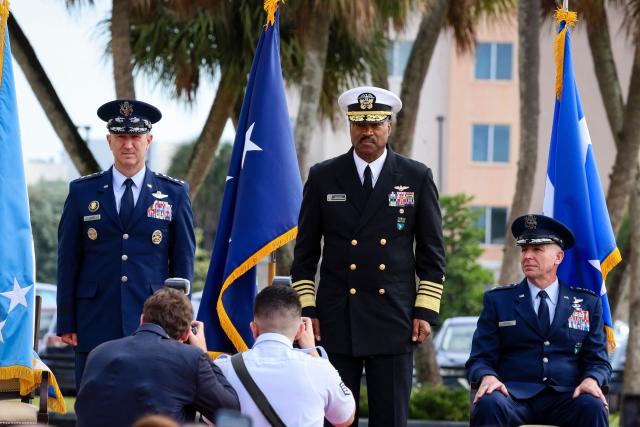 US Air Force Gen. Dan Caine, chairman of the Joint Chiefs of Staff (L), US Navy Adm. Alvin Holsey (C), outgoing commander of US Southern Command, and US Air Force Lt. Gen. Evan L. Pettus (R) are seen during Holseys relinquishment of command and retirement ceremony at US Southern Command (SOUTHCOM) headquarters in Doral, Florida, on December 12, 2025. The US admiral responsible for overseeing a major military buildup in the Caribbean and controversial strikes on alleged drug-smuggling boats stepped down on Friday just a year into his tenure. (Photo by Eva Marie UZCATEGUI / AFP)