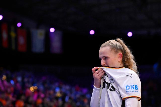Germany's centre back #23 Annika Lott reacts as she celebrates her team's victory at the end of the IHF Women's Handball World Championship semi final match between France and Germany in Rotterdam Ahoy Arena, in Rotterdam, on December 12, 2025. (Photo by JOHN THYS / AFP)