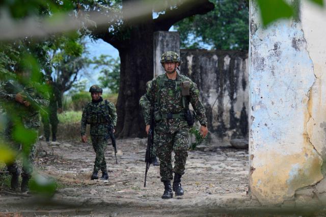 Colombian soldiers patrol an illegal trail on the Colombia-Venezuela border, near Cucuta, Norte de Santander Department, Colombia on December 12, 2025. (Photo by SCHNEYDER MENDOZA / AFP)