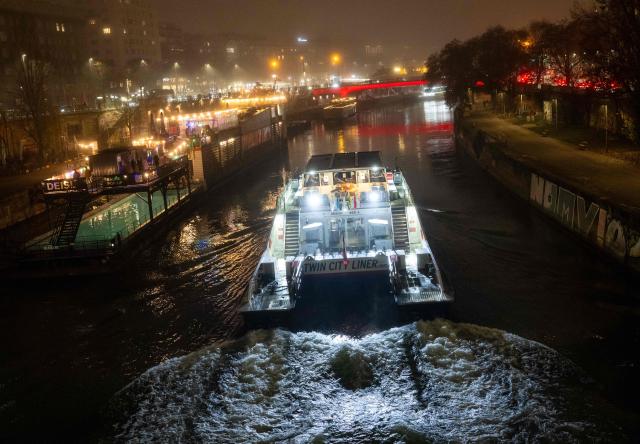 River boat Twin City Liner (between Vienna and Bratislava) arrives at the Vienna’s downtown port at Danube river on a hazy wintery day in Vienna, Austria on December 12, 2025. (Photo by Joe Klamar / AFP)