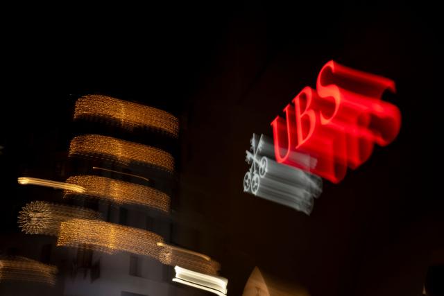 A picture taken on December 12, 2025 shows a sign of Swiss giant banking UBS at a branch in St. Moritz. Swiss parliamentarians are considering a compromise on the stricter banking regulations sought by the government, sending shivers through the stock of banking giant UBS, which has been opposing a proposal concerning the capital requirements of its foreign subsidiaries for months. (Photo by Fabrice COFFRINI / AFP)