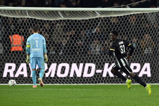 Angers' Cameroonian forward #31 Djibirin Harouna (R) celebrates scoring his team's fourth goal during the French L1 football match between SCO Angers and FC Nantes at the Raymond-Kopa Stadium in Angers, western France, on December 12, 2025. (Photo by JEAN-FRANCOIS MONIER / AFP)