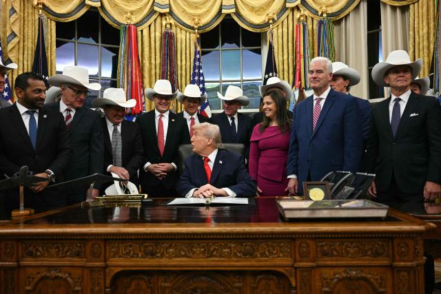 US President Donald Trump speaks during a bill signing ceremony with members of the 1980 US Olympic men's ice hockey team in the Oval Office of the White House in Washington, DC, on December 12, 2025. The legislation will award all of the players with Congressional Gold Medals to recognize the 45th anniversary of the US victory at the 1980 Winter Olympic Games. (Photo by Jim WATSON / AFP)