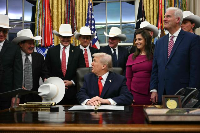US President Donald Trump speaks during a bill signing ceremony with members of the 1980 US Olympic men's ice hockey team in the Oval Office of the White House in Washington, DC, on December 12, 2025. The legislation will award all of the players with Congressional Gold Medals to recognize the 45th anniversary of the US victory at the 1980 Winter Olympic Games. (Photo by Jim WATSON / AFP)