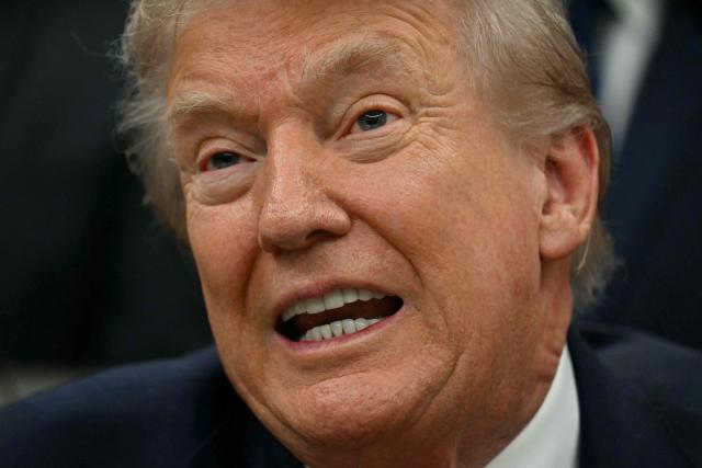 US President Donald Trump speaks during a bill signing ceremony with members of the 1980 US Olympic men's ice hockey team in the Oval Office of the White House in Washington, DC, on December 12, 2025. The legislation will award all of the players with Congressional Gold Medals to recognize the 45th anniversary of the US victory at the 1980 Winter Olympic Games. (Photo by Jim WATSON / AFP)