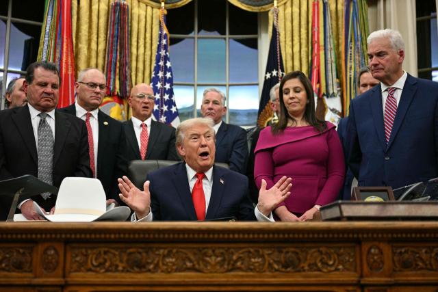 US President Donald Trump speaks during a bill signing ceremony with members of the 1980 US Olympic men's ice hockey team in the Oval Office of the White House in Washington, DC, on December 12, 2025. The legislation will award all of the players with Congressional Gold Medals to recognize the 45th anniversary of the US victory at the 1980 Winter Olympic Games. (Photo by Jim WATSON / AFP)
