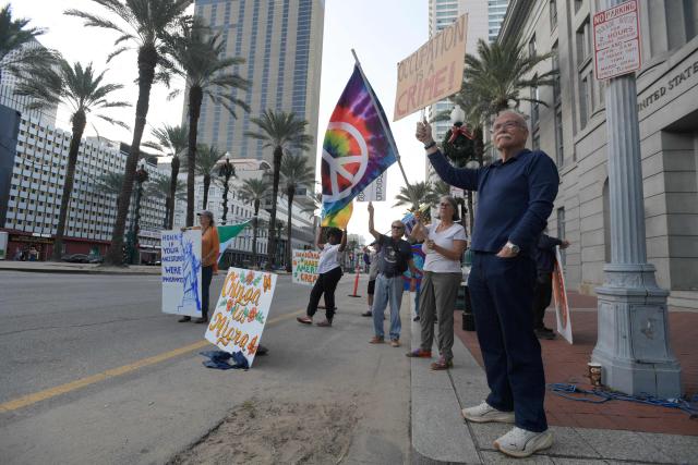 Residents of New Orleans protest outside of the US Customs and Border Protection Office on December 12, 2025 in New Orleans, Louisiana. The Department of Homeland Security launched Operation Catahoula Crunch on December 3 with the stated goal of arresting illegal immigrants with criminal records in New Orleans and surrounding parishes. (Photo by Matthew HATCHER / AFP)