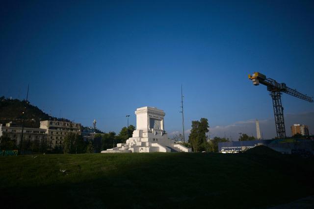 A view of the pedestal where the Baquedano monument once stood in Plaza Italia, the symbolic epicenter of the 2019 social unrest, taken in Santiago on December 12, 2025. The statue of General Manuel Baquedano, a historic figure in Chile's War of the Pacific, was removed in 2021 after repeated acts of vandalism during mass protests demanding social and political reforms. (Photo by Eitan ABRAMOVICH / AFP)