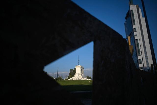 A view of the pedestal where the Baquedano monument once stood in Plaza Italia, the symbolic epicenter of the 2019 social unrest, taken in Santiago on December 12, 2025. The statue of General Manuel Baquedano, a historic figure in Chile's War of the Pacific, was removed in 2021 after repeated acts of vandalism during mass protests demanding social and political reforms. (Photo by Eitan ABRAMOVICH / AFP)
