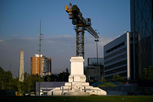 A view of the pedestal where the Baquedano monument once stood in Plaza Italia, the symbolic epicenter of the 2019 social unrest, taken in Santiago on December 12, 2025. The statue of General Manuel Baquedano, a historic figure in Chile's War of the Pacific, was removed in 2021 after repeated acts of vandalism during mass protests demanding social and political reforms. (Photo by Eitan ABRAMOVICH / AFP)