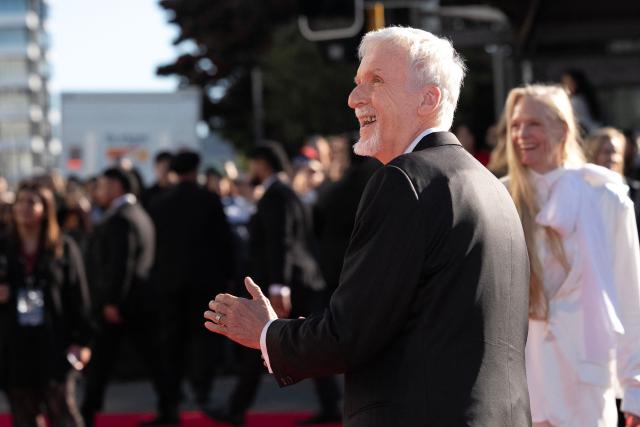 Avatar director James Cameron and his wife Suzy Cameron attend the Australasian premiere of Avatar Fire and Ash in Wellington on December 13, 2025. (Photo by Marty MELVILLE / AFP)