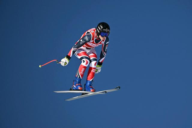 France's Romane Miradoli competes in the women's downhill race during the FIS Alpine Ski World Cup 2025-2026, in St Moritz, south-eastern Switzerland on December 13, 2025. (Photo by Fabrice COFFRINI / AFP)