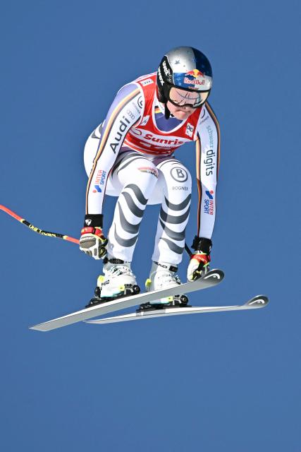 Germany's Emma Aicher competes in the women's downhill race during the FIS Alpine Ski World Cup 2025-2026, in St Moritz, south-eastern Switzerland on December 13, 2025. (Photo by Fabrice COFFRINI / AFP)