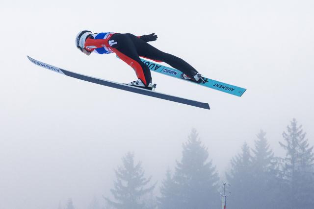 Norway's Heidi Dyhre Traaserud soars through the air during the qualification to the Women's Individual Large Hill HS140 event of the FIS Ski Jumping World Cup in Klingenthal, eastern Germany on December 13, 2025 (Photo by JENS SCHLUETER / AFP)